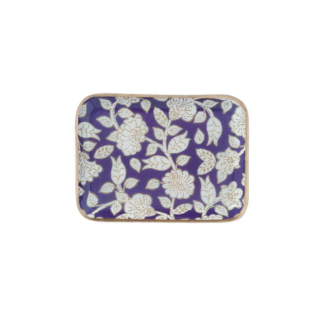 Decorative enamel tray with white floral pattern on a white background