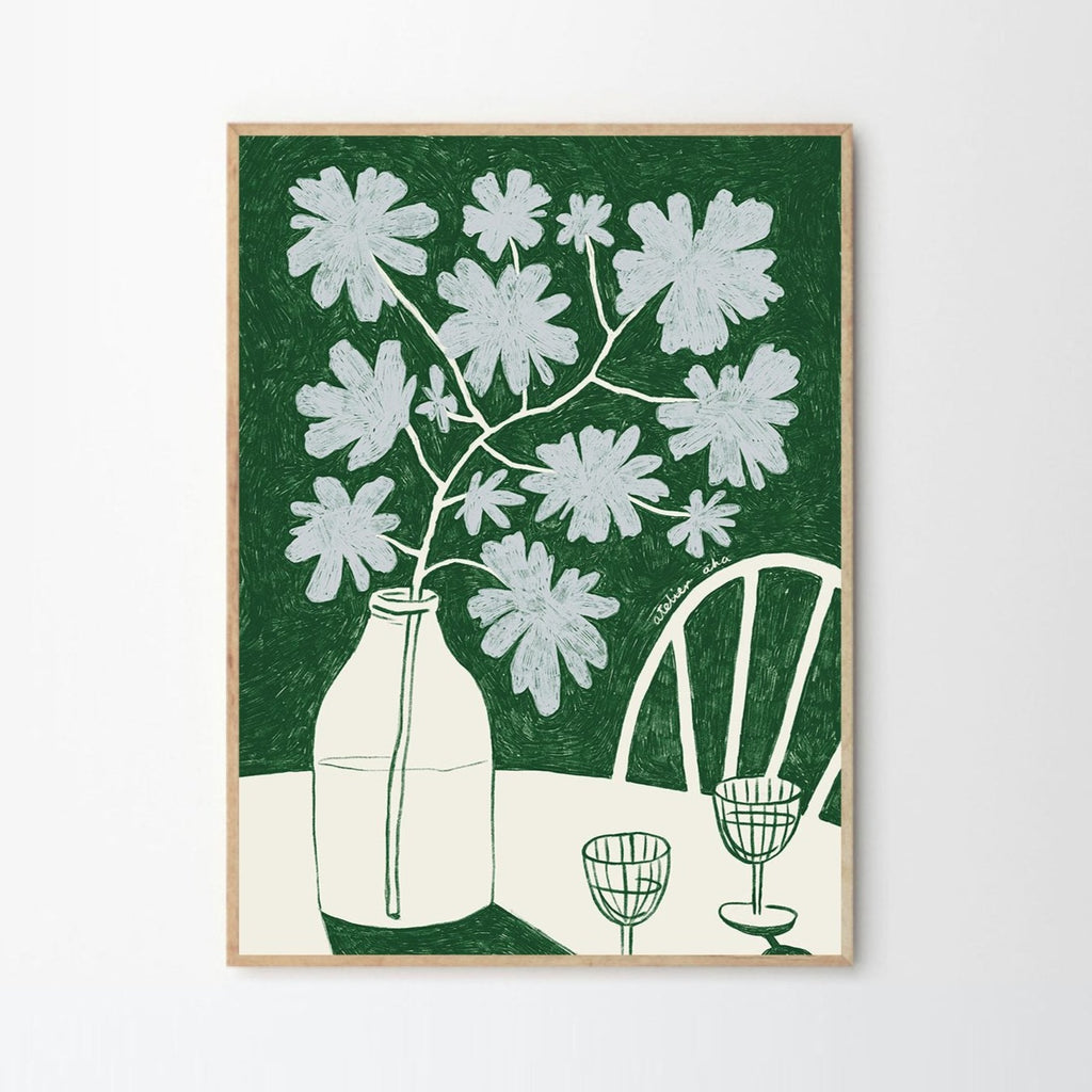 Green art print with flowers in a bottle and wine glasses