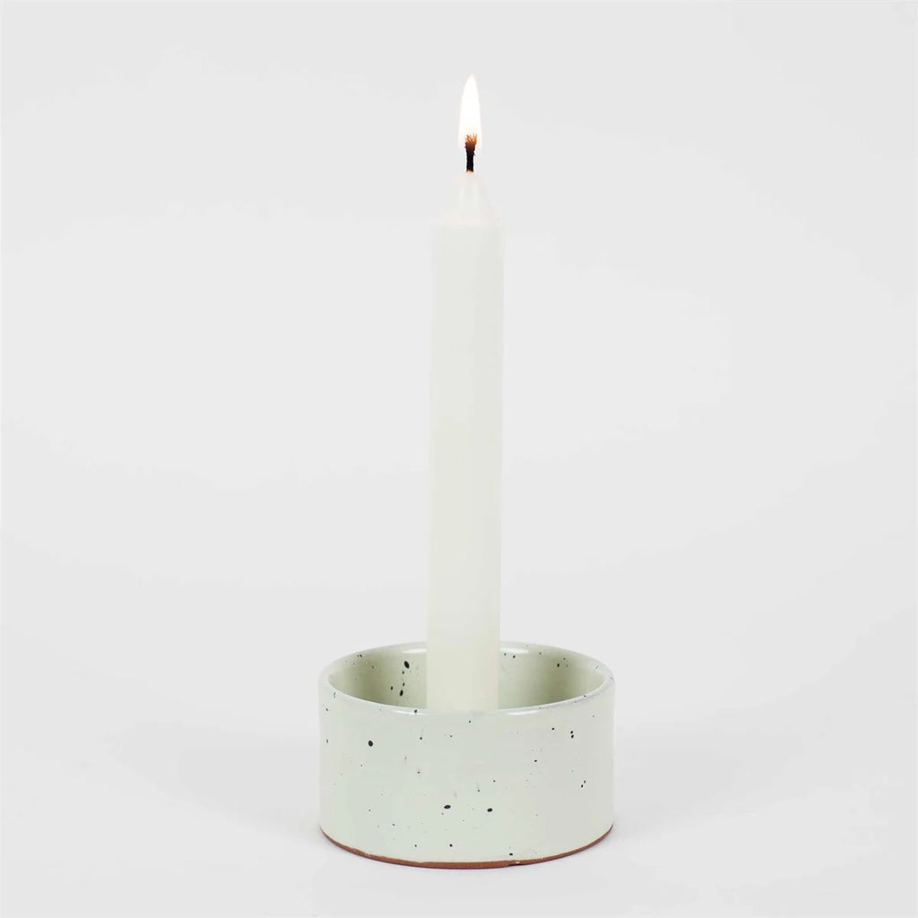 Handmade speckled candleholder with white dinner candle