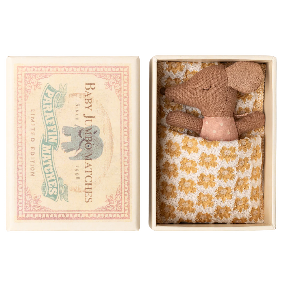 Small brown toy mouse in a decorative box with floral pattern