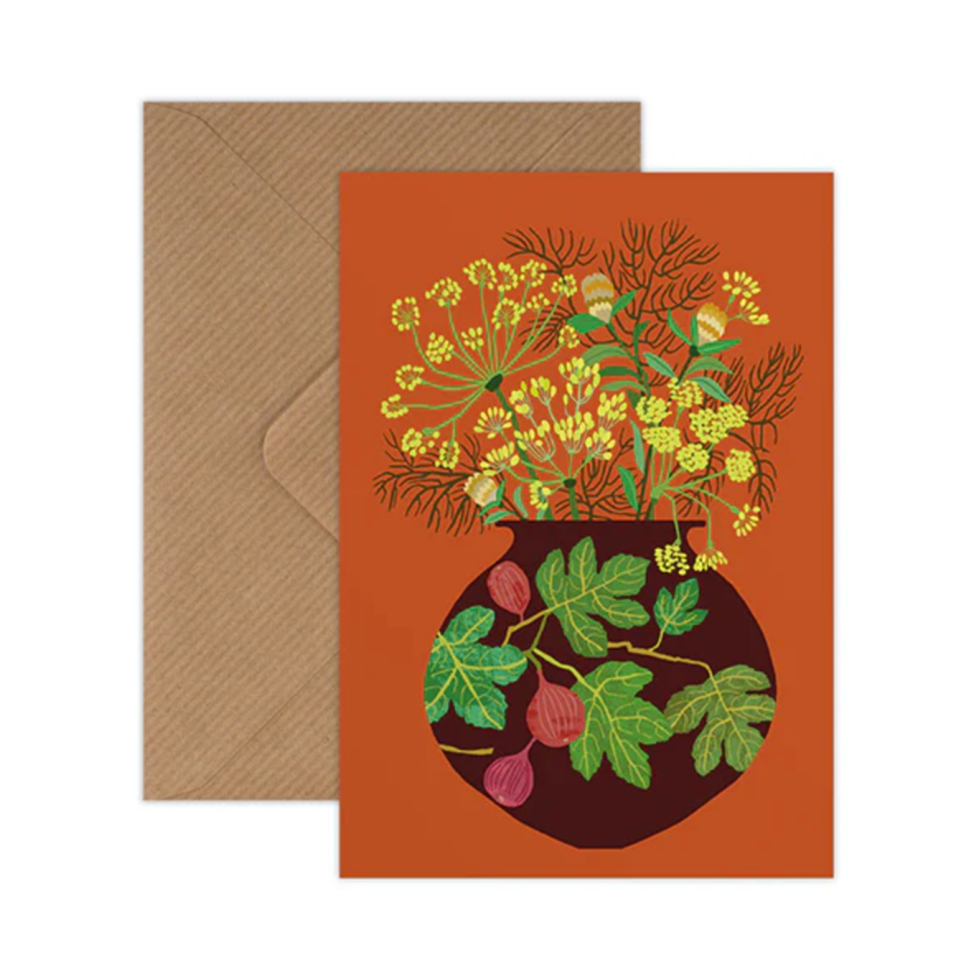 Greeting card with floral design and brown envelope on white background