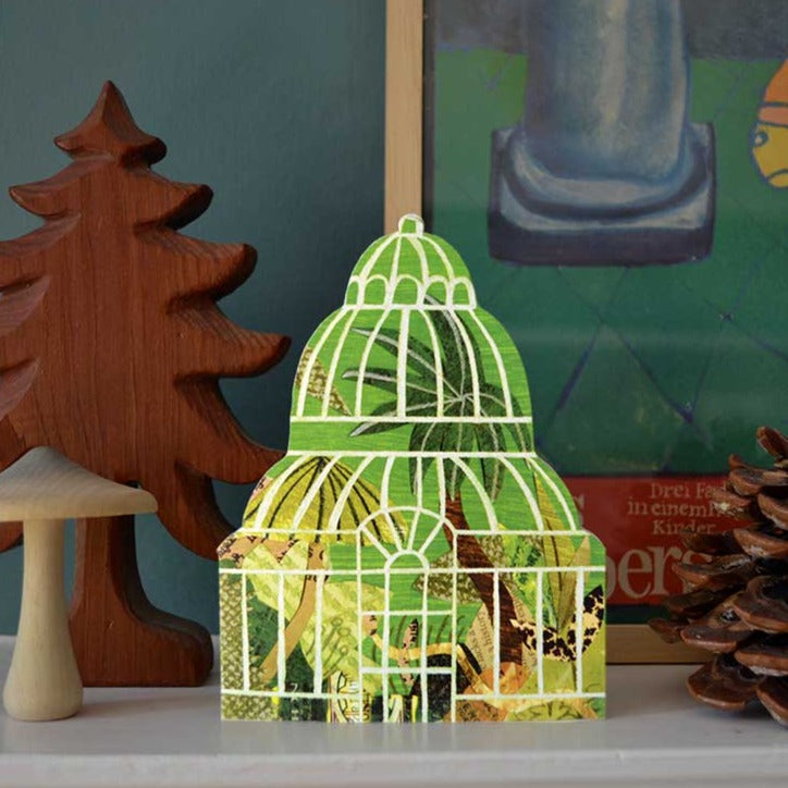 Die-cut palm house shaped card, featuring green leaves, palms and plants created using collage and paint, by Mortlake Papers.