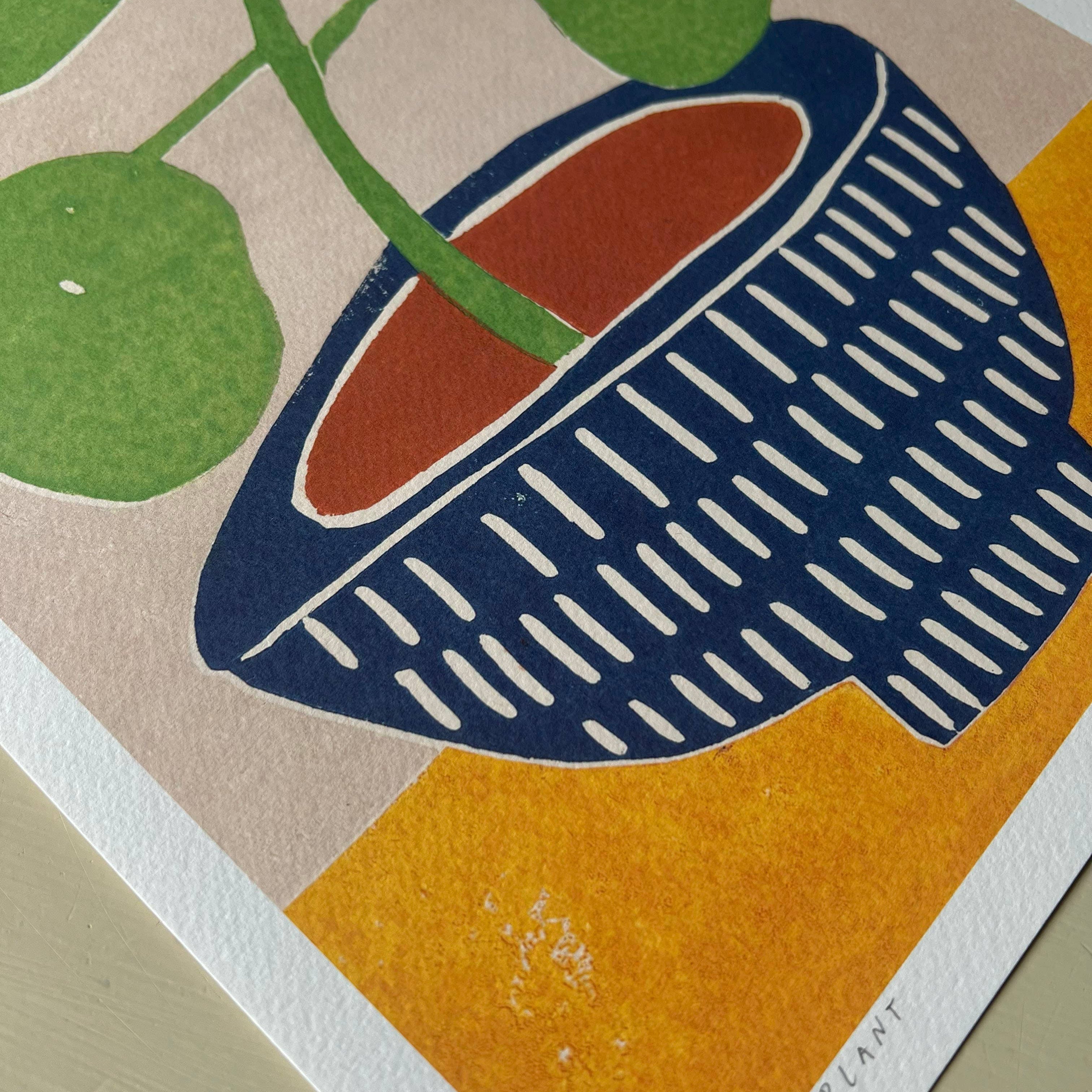 Illustration of a potted plant with green leaves on a multicolored background