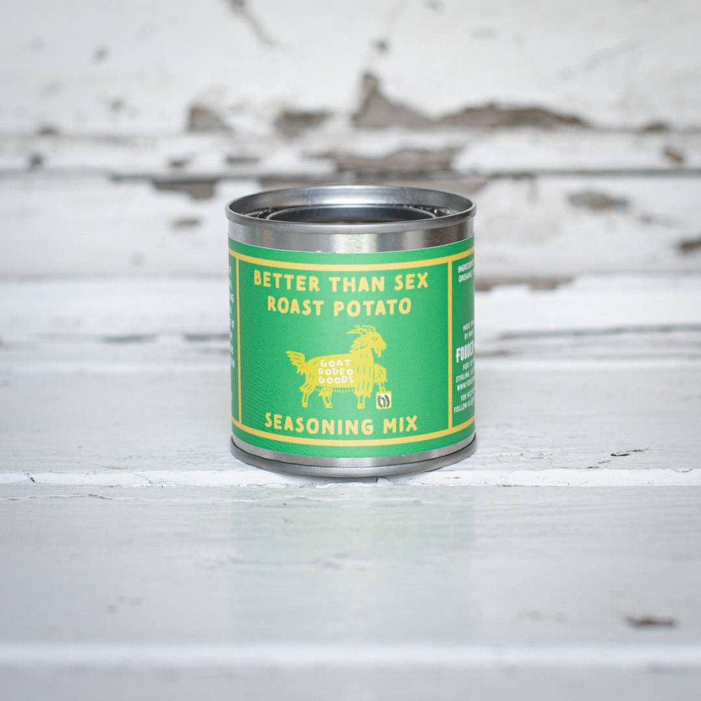 Can of roast potato seasoning mix with green label on a wooden surface