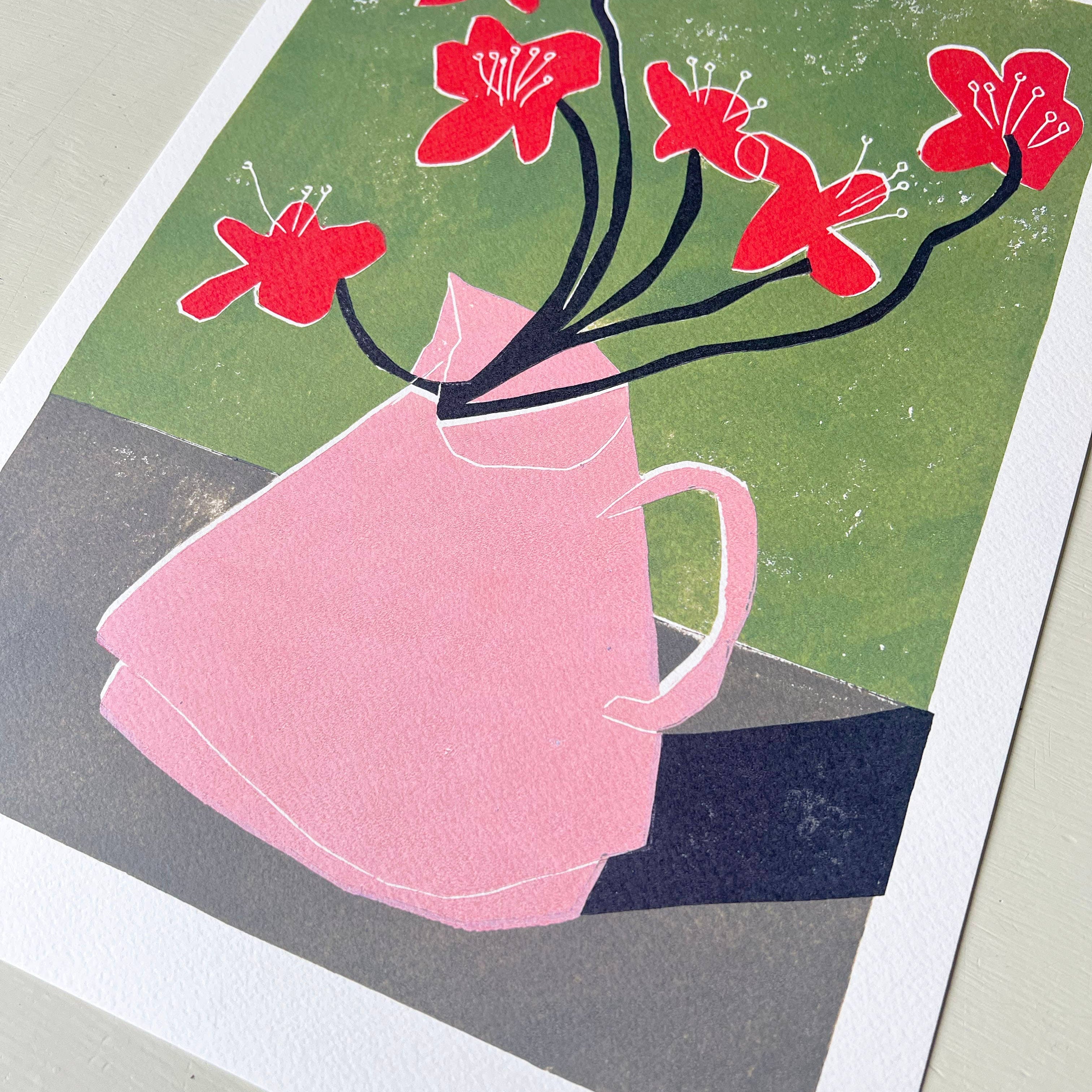 Print of a pink vase with red flowers against a green background