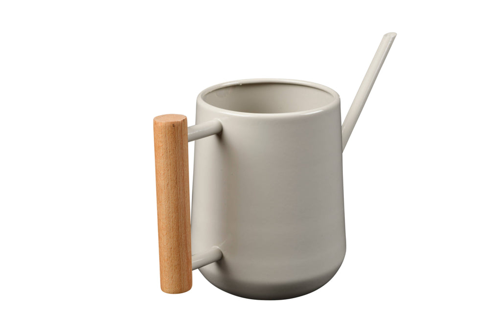 White ceramic mug with wooden handle and straw on a white background