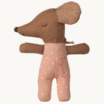Brown plush toy with a pink outfit on a white background