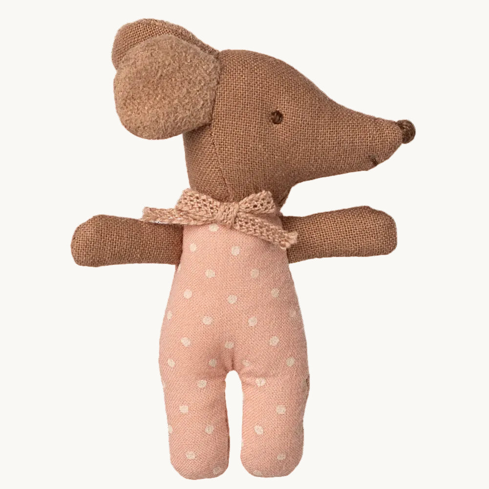 Stuffed toy mouse with a bow tie on a white background