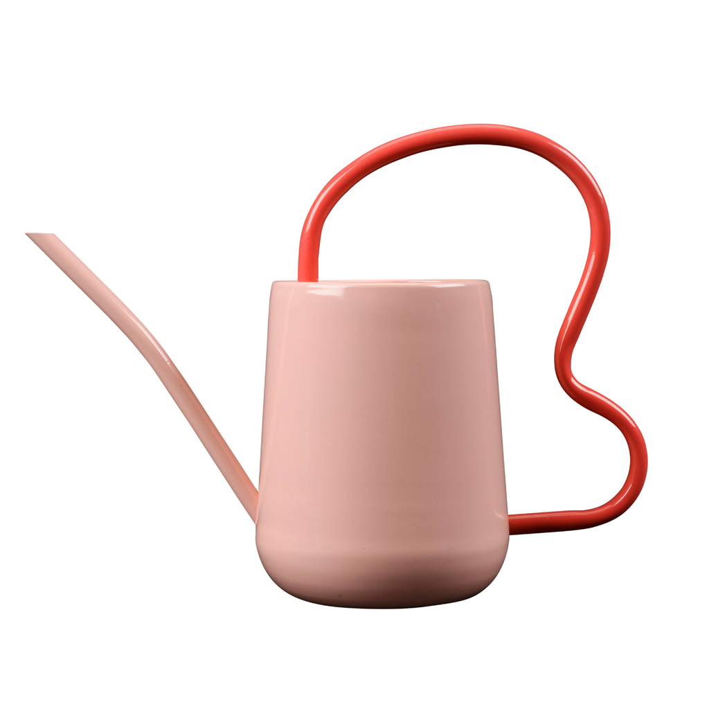 Pink watering can with red handle on a white background