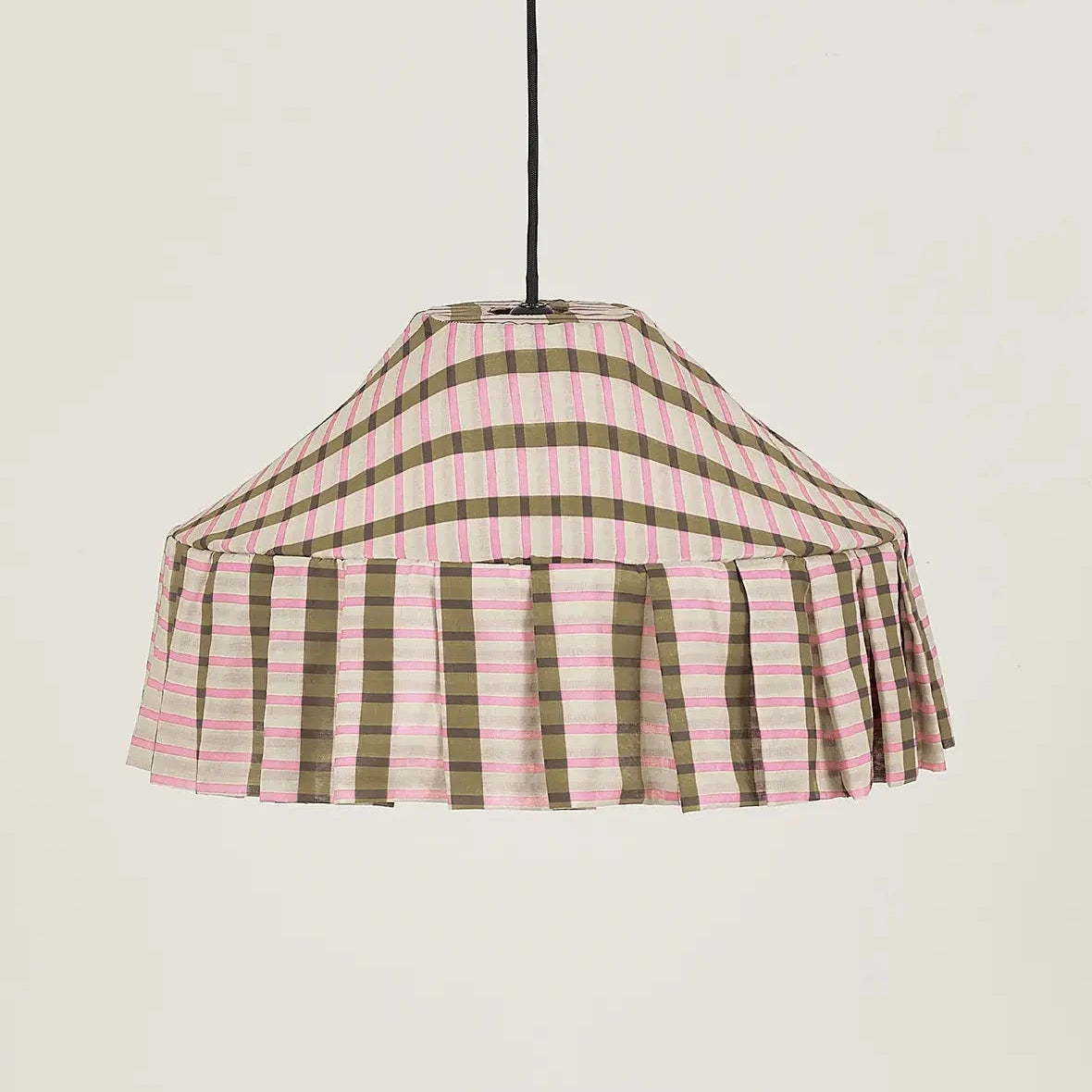 Fabric pendant lampshade with a khaki and pink mosaic pattern, hanging against a cream background