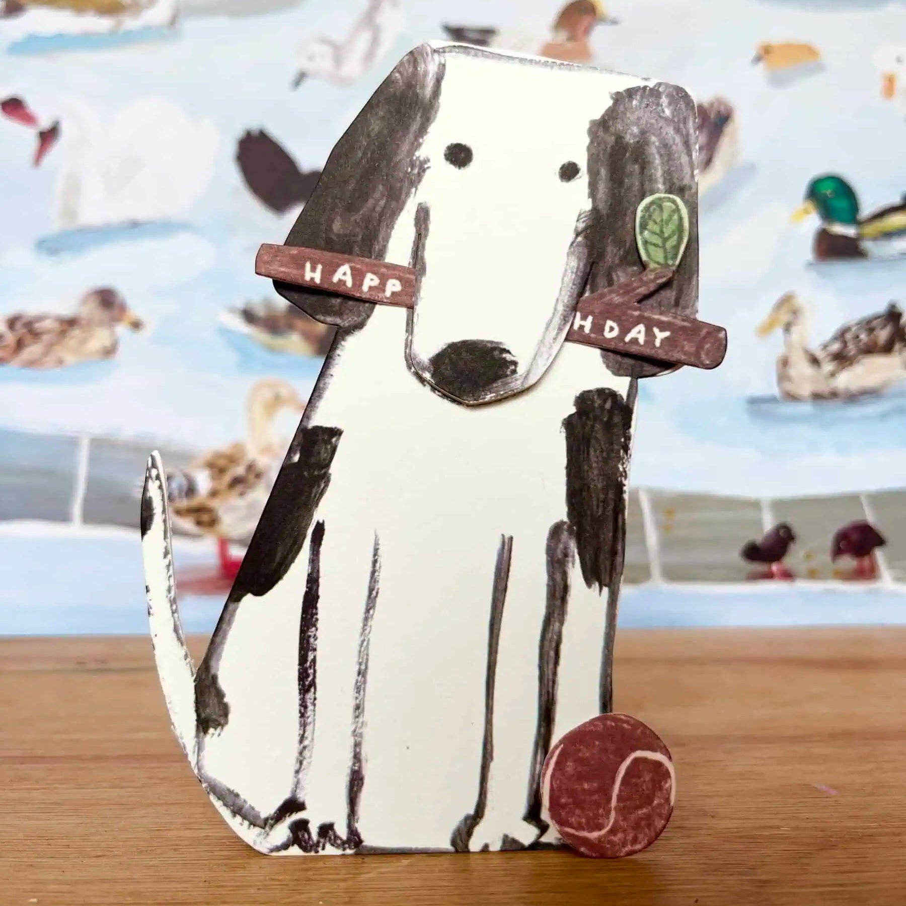 laura skilbeck - dog and ball happy birthday card - winter's moon