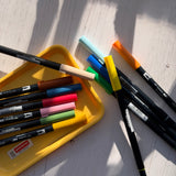 tombow abt - variety of coloured pens on white background - winter's moon