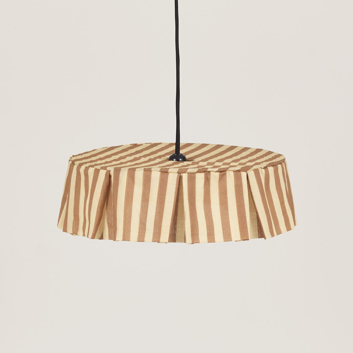 Striped pendant lampshade on a beige background