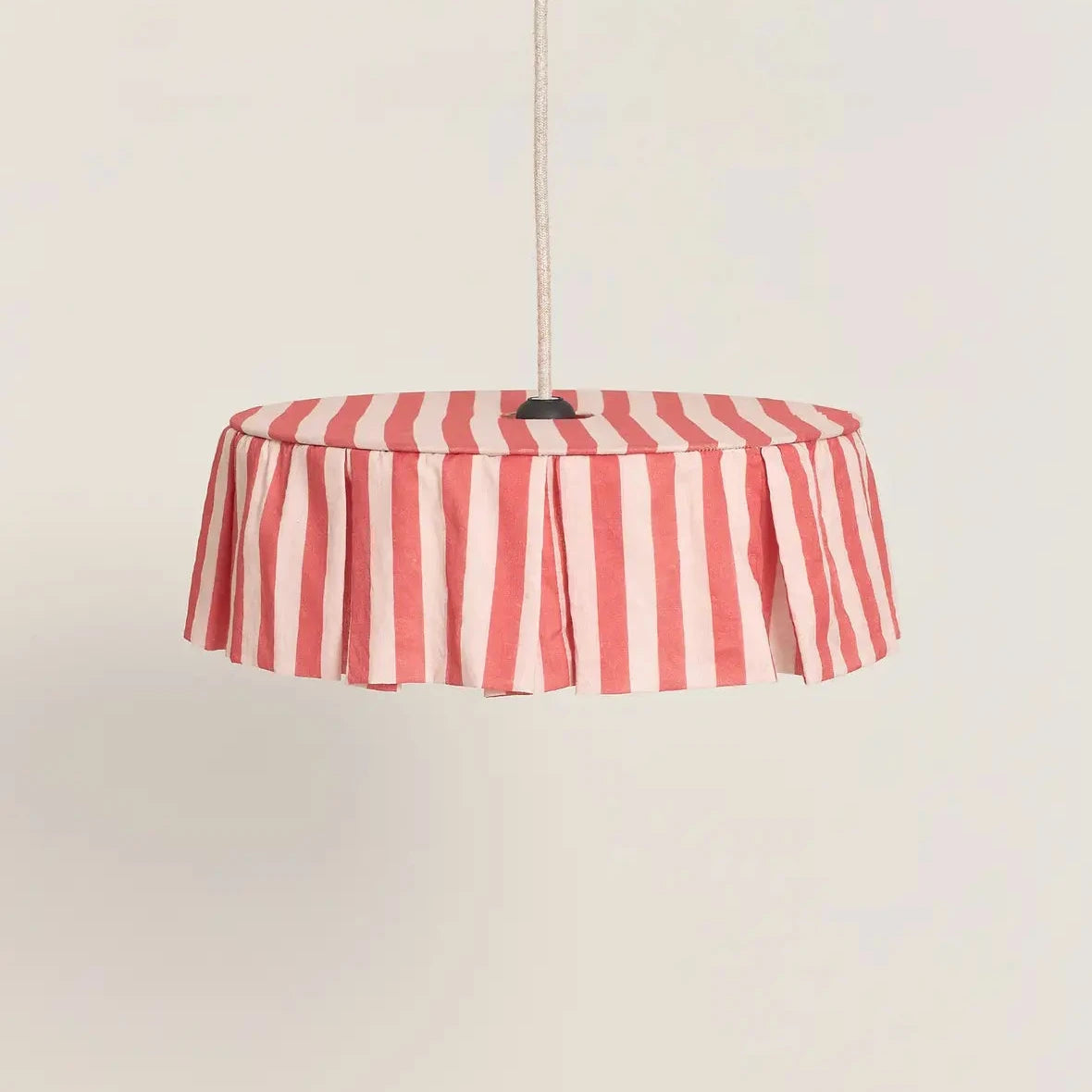 Red and pale pink striped pendant light on a beige background