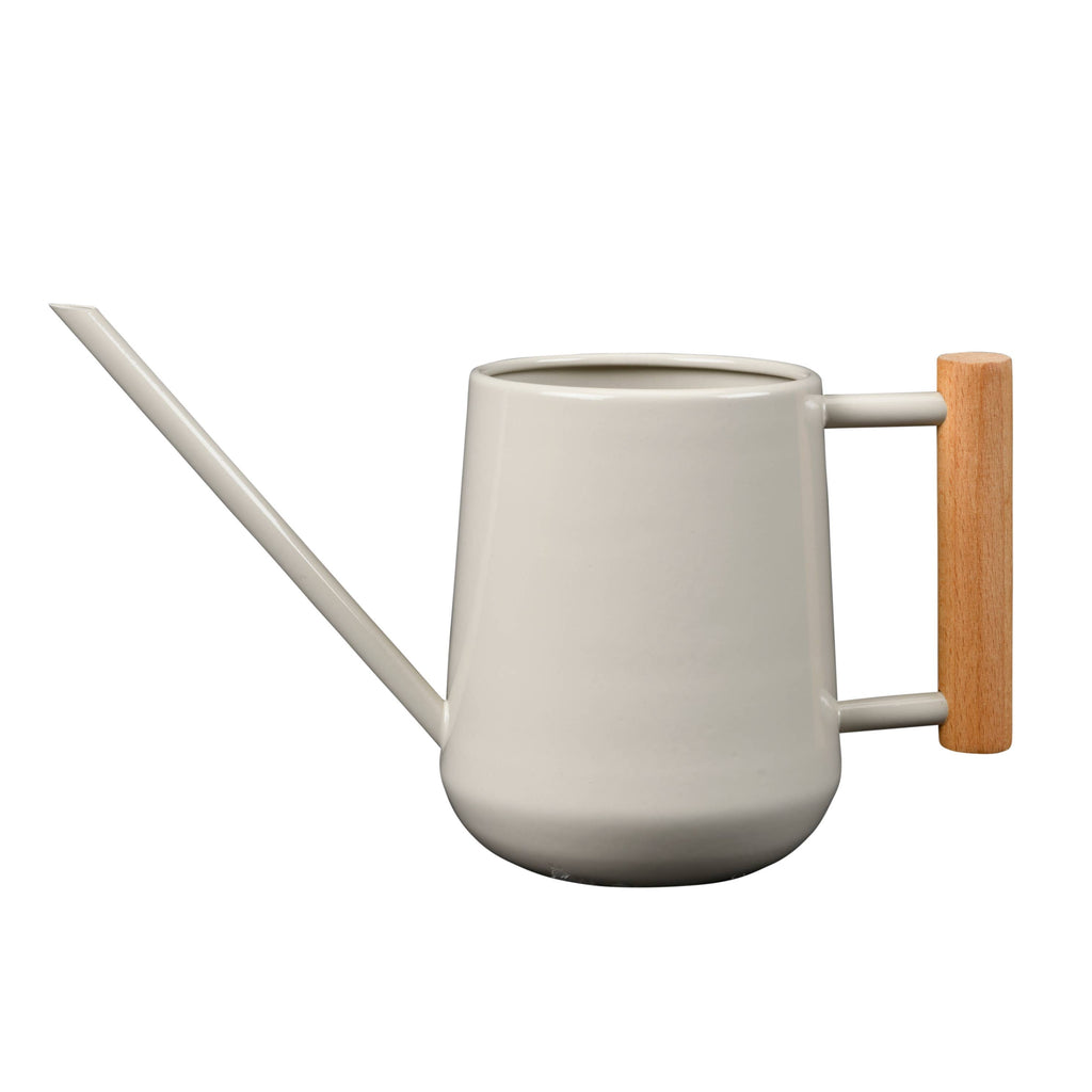 White watering can with a wooden handle on a white background